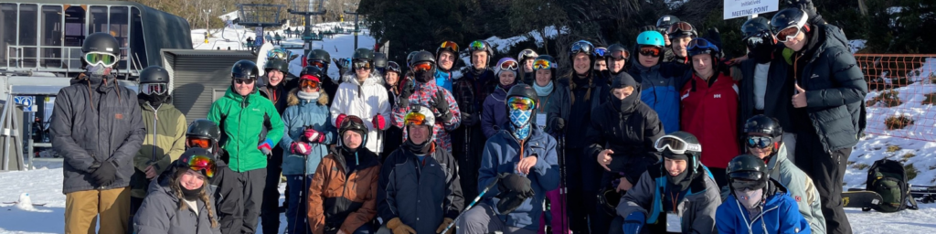 Students on snow sport camp posing for group photo